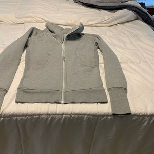 asymmetrical, funnel neck, Sz.2. (relaxed, fit).  Fits more like a sz. 4.